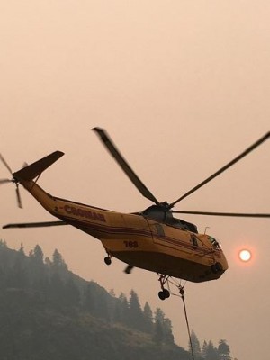 Photo by Marshall Wallace, USFS Helicopter at Foster Field helibase is being used to drop water on the Diamond Creek Fire, burning in the Pasayten Wilderness. 