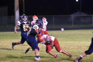 Senior Full Back Zane Scott carried in the ball for a two-point conversion under Friday Night Lights at Oroville's Ben Prince Field.