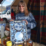 Jessie Cook of Tonasket, showing off one of her cut-glass creations, has been attending the Faire the past 24 years.