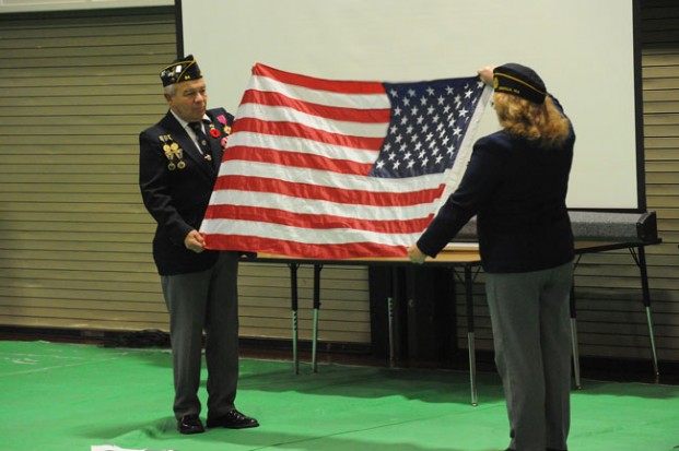 Walt and Vicki Hart perform the flag folding ceremony.