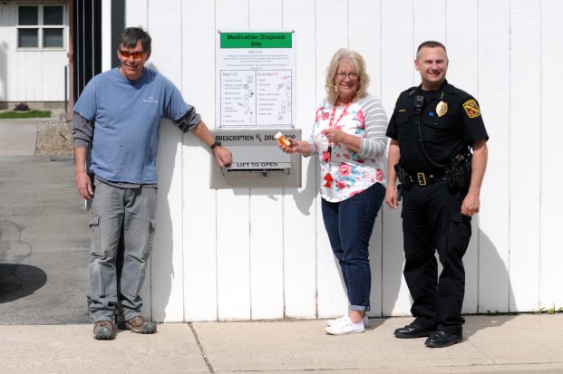 Gary DeVon/staff photo Oroville Mayor Jon Neal, president of the Oroville CARES Coalition and the Coalition’s Executive Director, Marlene Barker, gathered with Police Chief Todd Hill to officially open the new drop box to the public last week. 