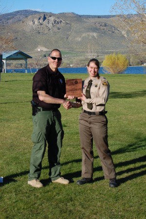 USBP/submitted photo USBP Agent and Oroville Explorer Post Advisor John Tafolla presents Theresa Fast with a plaque naming her Explorer of the Year at a ceremony held at Oroville's Deep Bay Park.