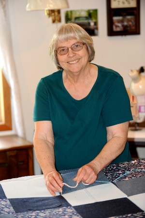 Gary DeVon/staff photo  Elva Helm, this year’s Oroville May Festival Grand Marshal working on a quilt in her sewing room. The quilt is one of the many she has donated over the years to help raise funds for the Molson Midsummer Festival. 