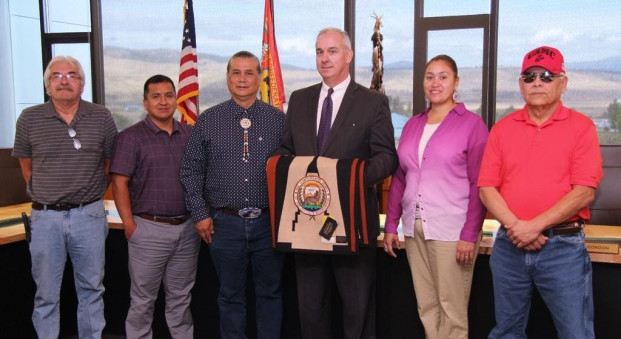 Submitted photo FEMA Region 10 Administrator Mike O’Hare is presented with a Pendleton blanket by Colville Business Council Vice Chairman Andy Joseph, Jr. commemorating the first-ever tribal declaration in the region. Pictured from left to right: Colville Business Council members Joseph Somday (Keller District), Richard Moses (Omak District), Vice Chairman Andy Joseph, Jr. (Nespelem District), FEMA Region 10 Administrator Mike O’Hare, Andrea George (Nespelem District) and Rich Swan (Inchelium District).