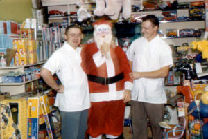Submitted photo  Roy and Lloyd Curtis with Santa Claus at Roys Pharmacy in 1958. The two were brothers, friends and partners, says Lloyd Curtis. 