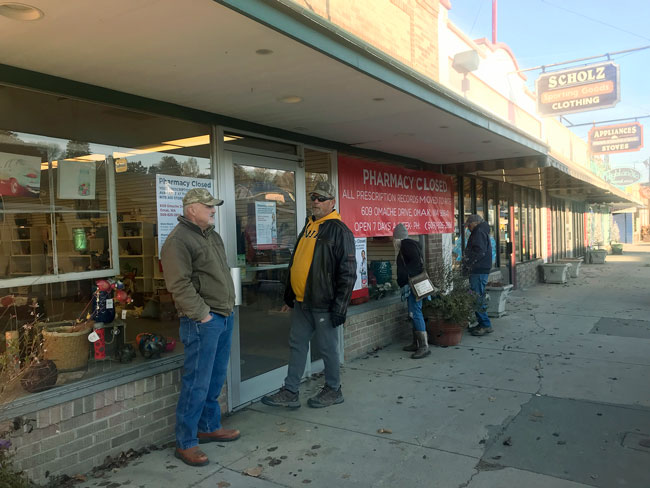 Early Monday morning, on Nov. 19, 2018 a crowd began to gather at the closed doors of Roy’s Pharmacy. They were awaiting the 9 a.m. clearance sale of all gift items in the store. The chatter amongst the group was still of disbelief, as they processed what the town will do with no pharmacy. Laura Knowlton/staff photo