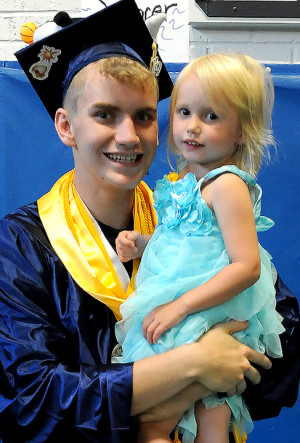 Class Valedictorian Spencer Martin and a young fan.