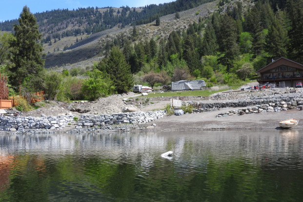 DOE Photo A Kelowna couple has come to an agreement with the Washington State Department of Ecology for not having permits to build a rock retaining wall or place fill in the lake to create a pad for a residence and other shoreline violations. 