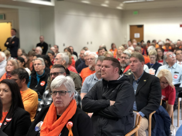 Leona Vaughn/WNPA News Service With photo: Washington residents at a Senate Law and Justice Committee hearing on a proposed ban on high capacity gun magazines this week. Many wore orange in support of gun safety.
