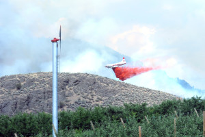 Gary DeVon/staff photo  A fire bomber plane attacks the Swanson Mill Fire.