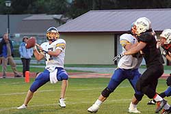 Tonasket Tiger Quarterback Sean Timmerman draws back for a pass. Timmerman made the first team for the CTL All League Football as a quarterback on offense and as a lineman on defense, as well as a punter.