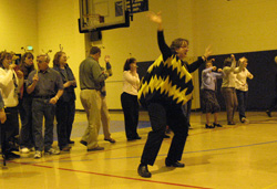 Photo by Amy Veneziano                Elementary school principal Lynn Johnson brought teachers to their feet while student’s reading accomplishment March 3. All of the teacher