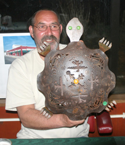 Photo by Gary DeVonJerry King, a self-described member of the Turtle Clan, shows off the turtle his wife bought for him during the auction at the Habitat for Humanities benefit. The event, held at the River’s Edge