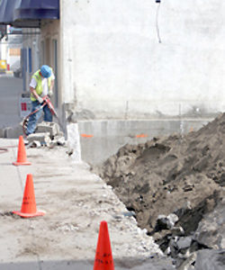 Photo by Gary DeVon Brad Calico, with Oroville Public Works, takes a pneumatic jackhammer to the remains of the low cement wall that was removed from the front of what will soon be Oroville’s Centennial Par