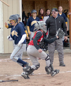 Photo by Gary A. DeVon                Oroville’s Reinna Quick is brought home on an Emily Graham triple last week against the Waterville Shockers. The Hornets easily won each o