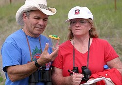 Photo by Gary DeVonWalt and Vicki Hart get an up close look at one of the many species of butterflies that inhabit the Sinlahekin Wildlife Area during last year’s Watchable Wildlife Weekend. Dale and Kathy Swedberg will lead the tour in one of the e