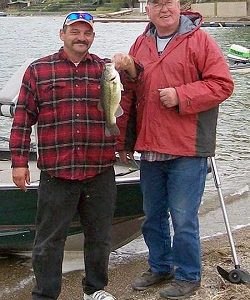 The big largemouth bass weighing 1.82 pounds was caught by the team of Jim Barker (left) and Cliff Applebee.