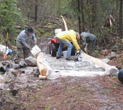 Photos by Amy VenezianoFrom left, Dave Sunde, Trygve Culp and Tom Winsor dump gravel on a newly-installed turnpike at the Antoine Trail last week. This spot is about a mile from Forest Service road access.