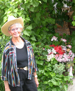 Photo by Gary DeVon                &amp;nbsp;&amp;nbsp;&amp;nbsp; Darlene Owyn stands beside one of the garden features at the lakeside home she and her late-husband Allan purcha