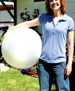 Photo by Amy Veneziano	Fitness instructor Melody Williams is armed and ready to work – out, that is – with a Swiss ball near her temporary Tonasket home.