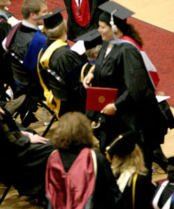 Photo by Gary DeVonNichole DeVon (standing, with diploma) after receiving her double Master’s Degree from EWU, Saturday, June 14.
