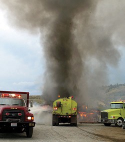 Photos by Amy Veneziano    Crews from Tonasket, Oroville and Omak were at the fire at various times Tuesday. However, fires in Omak and Okanogan quickly left the north county on their own, when the Omak crew had to head bac