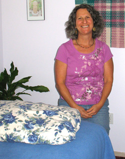 Photo by Amy Veneziano                &amp;nbsp;&amp;nbsp;&amp;nbsp; Priya Shellenbarger sits beside the reiki table in her Oroville home.