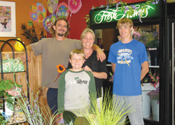 Photo by Amy Veneziano        &amp;nbsp;&amp;nbsp;&amp;nbsp; From left are Jay, Kelli and sons Abe and Spencer in the new Wild Rose Flower Shop in Tonasket. The shop sells flower and arrang