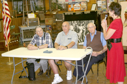 Photo by Gary DeVon	    Okanogan Borderlands Historical Society President Kay Sibley asked Ralph Patterson, Clayton Emry and Web Hallauer the question, “What was Main Street like when you first saw it?”