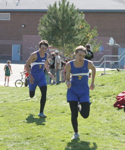 Photo by Terry Mills Two Tonasket cross country runners get close to the finish line at Saturday’s meet. The Tonasket boys’ team came in third overall. Photo of Spencer Podkranic, and Tyler Monroe for Tonasket.