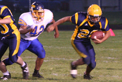 Photo by Terry Mills	Hornet Nicky Perez scores a first down with 4:20 left in the first half against Tonasket on Oroville's home field.