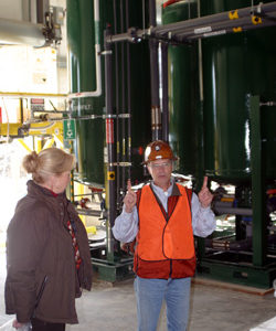 Photo by Gary DeVon            RichardSolopek, an environmental engineer with Kinross’ Kettle River Operations,describes the water treatment system at the m