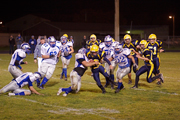 Photo by Eric Teala Photography	Hornet Luke Rowton tries to negotiate through traffic at last Friday’s home game against the La Salle Lightning. Rowton had four receptions for 60 yards and a touchdown.