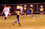 Photo by Gary DeVon	The Hornet’s Blaine Wagner returned a 55-yard interception against White Swan for one of Oroville’s only two touchdowns in a scary one-sided Halloween football game against the Cougars last Friday.