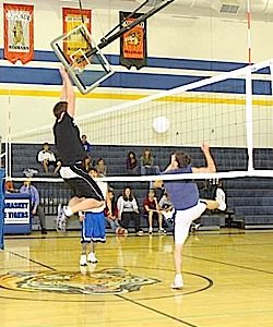 Photo by Terry MillsJunior Wade Detillian, on left, and Brandon Wahl and Josh McDaniel on the right during the juniors vs. seniors Macho Man Volleyball match on Wednesday, Nov. 12.