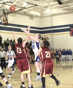 Photo by Terry MillsTonasket's Jessica Kitterman shoots the ball in the Tigers' game against Lake Roosevelt on Tuesday, Jan. 13. The Tigers won with 3.8 seconds left 61-60. Also shown are Moyatat Bell-Bart and Tiffany Adkins from Lake Roosevelt and Dana P