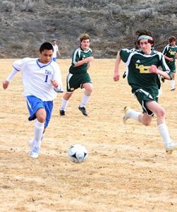 Photo by Terry MillsFreshman Kevin Aitcheson kicking the ball down the field against Liberty Bell on Thursday, March 19 in Tonasket’s first boys’ soccer game of the spring sports season.