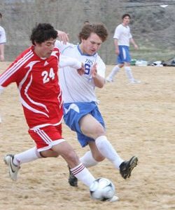 Photo by Terry MillsTonasket sophomore Keegan McCormick tries to steal the ball from a Brewster player during the soccer game on Tuesday, March 24. Tonasket lost at home to Brewster 8-0.