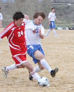 812a Photo by Terry MillsTonasket sophomore Keegan McCormick tries to steal the ball from a Brewster player during the soccer game on Tuesday, March 24. Tonasket lost at home to Brewster 8-0.