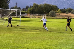 Manson lines up to take a shot at the goal with Hornet goalie Taylor Sariento defending. She had "great play" in the second half, according to Coach Laura Kinman. Photo by Les Bowen