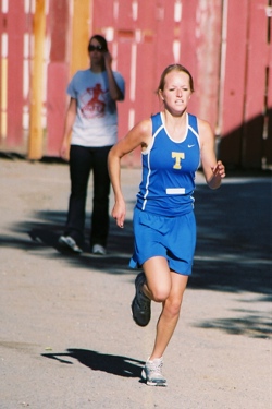 963a Jessica Spear of Tonasket running for the cross country team in the Omak meet Friday, Sept. 18. Spear finished in first place for the girls team with a time of 22:19.