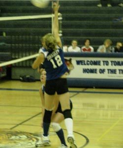 Tonasket freshman Devan Utt jumps up to hit the ball over the net during Tonasket’s home game against Cascade on Tuesday, Oct. 6. Tonasket lost in three sets of 25-17, 25-13 and 25-17. Also shown is junior Jessica Rhoads.Photo by Emily Hanson