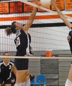 Oroville's Rebekkah McCoy, a junior, goes up for a block against Bridgeport in a match Tuesday, Oct. 6 on the Mustang's home court. Although the Lady Hornets lost, their coach described tit as one of the best games played all season. Photo by John Clevela