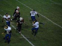 Tonasket junior wide receiver Tyler Laurie trying to evade Cashmere’s senior line backer Christian O’Neal during Tonasket’s loss at Cashmere on Friday, Oct. 9. Also shown are senior quarterback Wade Detillian (12), senior running back Andrew Grillo