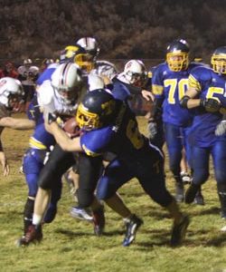 Tonasket defensive back Keegan McCormick tackling an Omak running back on Thursday, Oct. 29. The Pioneers were too fast for the Tigers and Tonasket lost at home 48-7. Photo by Terry Mills