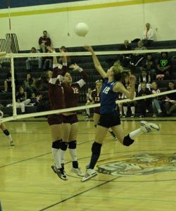 Tonasket freshman Devan Utt jumps up in the air to knock the ball back to Okanogan during Tonasket’s final home game of the season. Tonasket lost in three sets of 25-13, 26-24 and 25-16. Photo by Emily Hanson