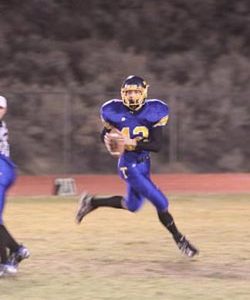 Tonasket senior quarterback Wade Detillian looks for an open receiver during Tonasket’s final game against Lakeside High School on Friday, Nov. 6. Tonasket won 14-7. Photo by Terry Mills