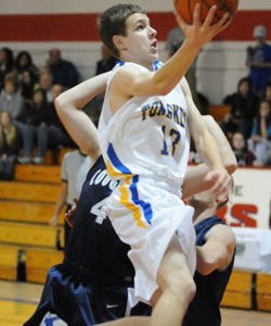 Tonasket sophomore Damon Halvorsen makes a layup shot against Cascade Christian during the Tigers first game at the Brewster Tournament on Tuesday, Dec. 29. Photo by John Cleveland, II