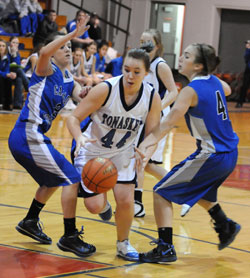 Tonasket senior April Webber handles the ball against Cascade Christian girls despite being double-teamed on Tuesday, Dec. 29. Photo by John Cleveland, II