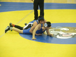 Tonasket junior Tyler Laurie holding down Warden’s Cesar Rangel as he attempts to turn him over during the 130 pound Championship Round at the Apple Pie Tournament in Tonasket on Saturday, Jan. 16. Laurie won by decision 5-2 for first place. Photo by Em